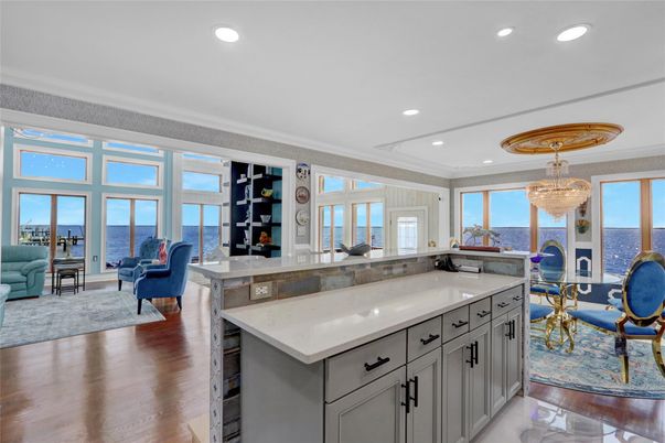 Chandelier, Dining room, Interior, Kitchen, Living room, Recessed Lighting, Water, Wood Texture Flooring
