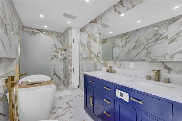 Bathroom, Dual Sink Vanities, Free Standing Baths, Interior, Marble, Marble Walls, Recessed Lighting