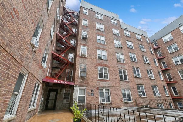 Exterior, Facade, Brick Facade, Condo Building