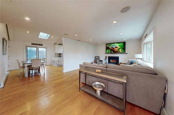 Dining room, Fireplace, Interior, Living room, Recessed Lighting, Wood Texture Flooring