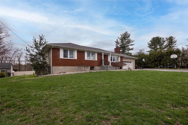 Attached, Backyard, Exterior, Facade, Brick Facade, Split Level