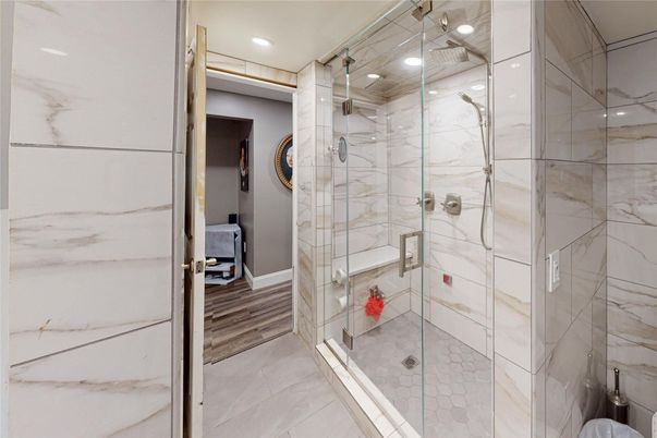 Bathroom, Glass Shower, Interior, Marble Walls, Recessed Lighting, Wood Texture Flooring