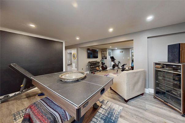 Fitness Equipment, Game Room, Interior, Living room, Recessed Lighting, Wood Texture Flooring