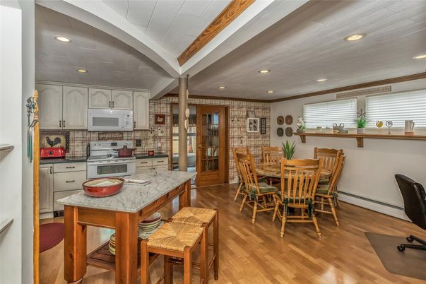 Dining room, Interior, Kitchen, Recessed Lighting, Stainless Steel Appliances, Wood Texture Flooring
