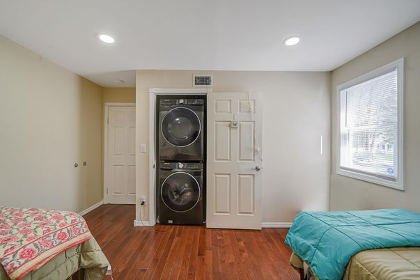 Bedroom, Interior, Recessed Lighting, Utility Closets, Washer, Wood Texture Flooring