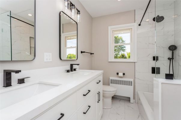 Bathroom, Dual Sink Vanities, Glass Shower, Interior, Marble, Marble Walls, Recessed Lighting
