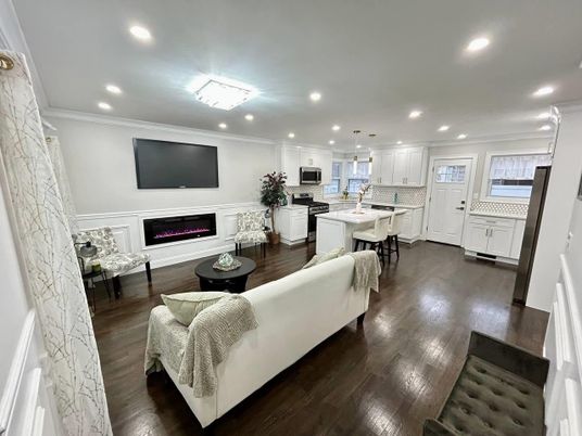 Fireplace, Interior, Kitchen, Living room, Pendant Lights, Recessed Lighting, Stainless Steel Appliances, Wood Texture Flooring
