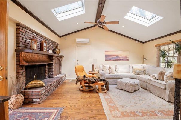 Fireplace, Interior, Living room, Recessed Lighting, Stone Walls, Wood Texture Flooring