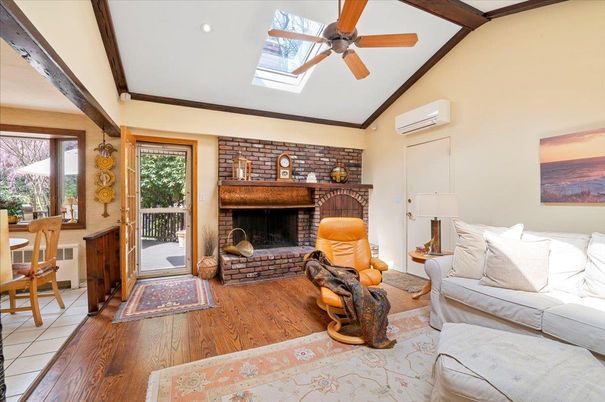 Fireplace, Interior, Living room, Recessed Lighting, Stone Walls, Wood Texture Flooring