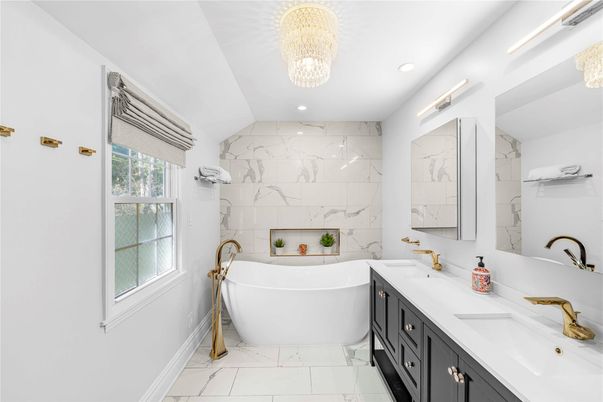 Bathroom, Chandelier, Dual Sink Vanities, Free Standing Baths, Interior, Marble, Marble Walls, Recessed Lighting