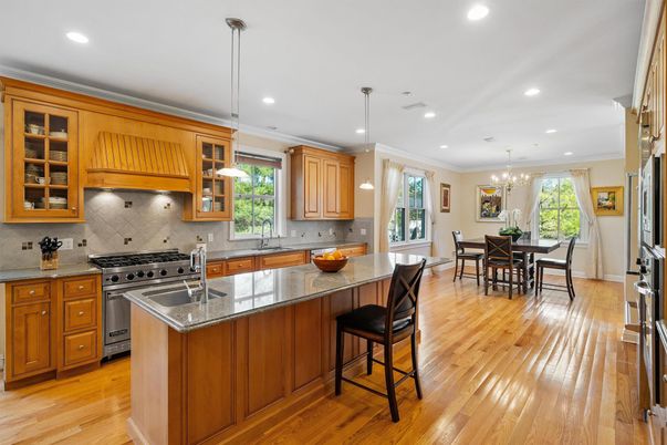 Chandelier, Dining room, Interior, Kitchen, Pendant Lights, Recessed Lighting, Stainless Steel Appliances, Wood Texture Flooring