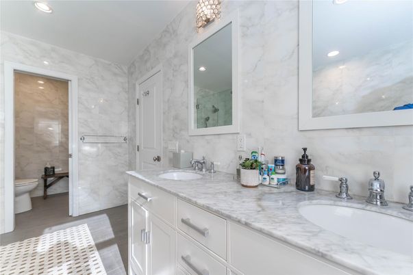 Bathroom, Dual Sink Vanities, Glass Shower, Interior, Marble Walls, Recessed Lighting