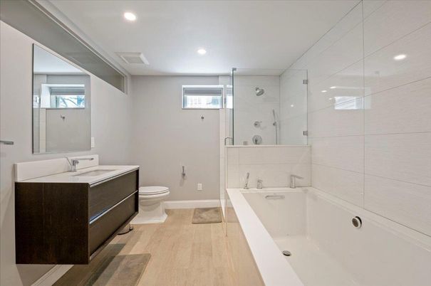 Bathroom, Dual Sink Vanities, Glass Shower, Interior, Recessed Lighting, Wood Texture Flooring