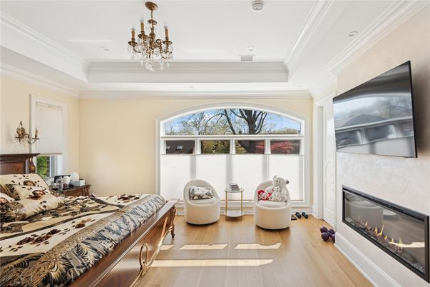 Bedroom, Chandelier, Fireplace, Interior, Recessed Lighting, Wood Texture Flooring