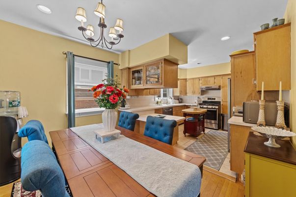 Chandelier, Dining room, Interior, Kitchen, Recessed Lighting, Stainless Steel Appliances, Wood Texture Flooring