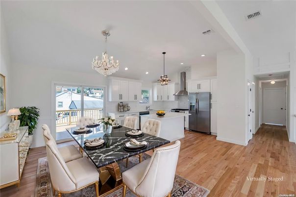 Chandelier, Dining room, Interior, Kitchen, Pendant Lights, Recessed Lighting, Stainless Steel Appliances, Wood Texture Flooring