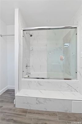Bathroom, Glass Shower, Interior, Marble Walls, Wood Texture Flooring