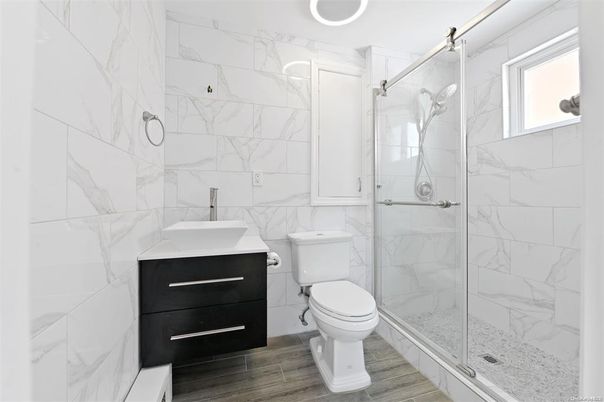 Bathroom, Glass Shower, Interior, Marble Walls, Wood Texture Flooring