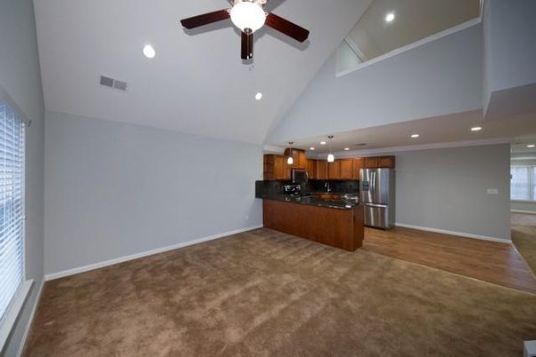 Empty room, Interior, Kitchen, Recessed Lighting, Stainless Steel Appliances, Wood Texture Flooring