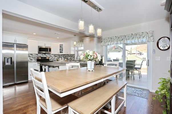 Dining room, Interior, Kitchen, Pendant Lights, Recessed Lighting, Stainless Steel Appliances, Wood Texture Flooring