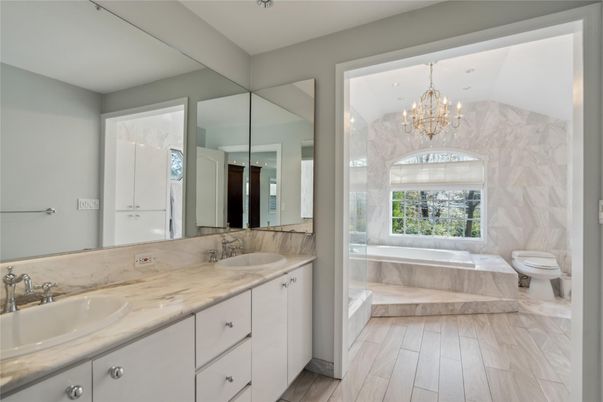 Bathroom, Chandelier, Dual Sink Vanities, Interior, Marble Walls, Wood Texture Flooring