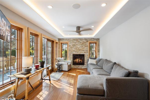 Fireplace, Interior, Living room, Recessed Lighting, Stone Walls, Wood Texture Flooring