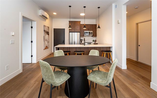Dining room, Interior, Kitchen, Pendant Lights, Recessed Lighting, Stainless Steel Appliances, Wood Texture Flooring