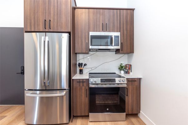 Interior, Kitchen, Marble Walls, Stainless Steel Appliances, Wood Texture Flooring