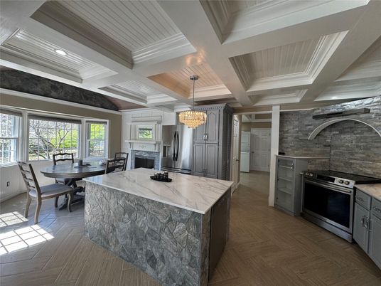Chandelier, Dining room, Interior, Kitchen, Recessed Lighting, Stainless Steel Appliances, Wooden Ceilings, Wood Texture Flooring
