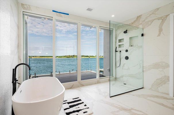 Bathroom, Free Standing Baths, Glass Shower, Interior, Marble, Marble Walls, Recessed Lighting, Water