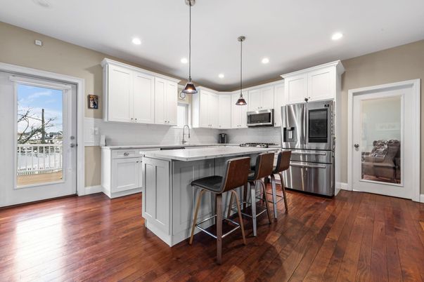 Interior, Kitchen, Pendant Lights, Recessed Lighting, Stainless Steel Appliances, Wood Texture Flooring