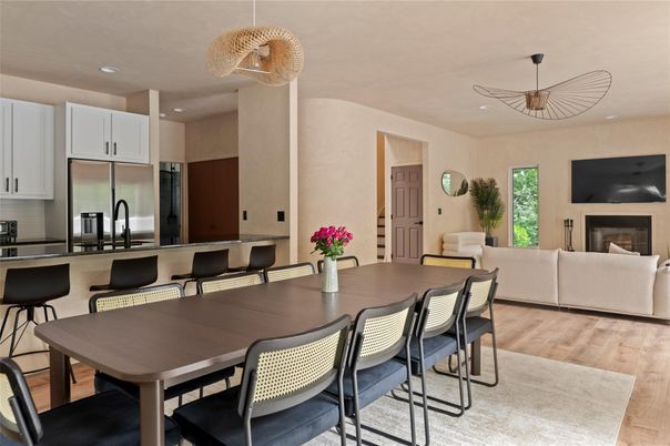 Dining room, Fireplace, Interior, Kitchen, Living room, Recessed Lighting, Stainless Steel Appliances, Wood Texture Flooring