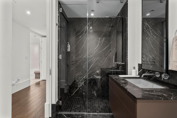 Bathroom, Glass Shower, Interior, Marble Walls, Recessed Lighting, Wood Texture Flooring