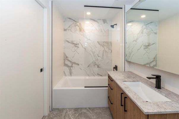 Bathroom, Dual Sink Vanities, Glass Shower, Interior, Marble Walls, Recessed Lighting