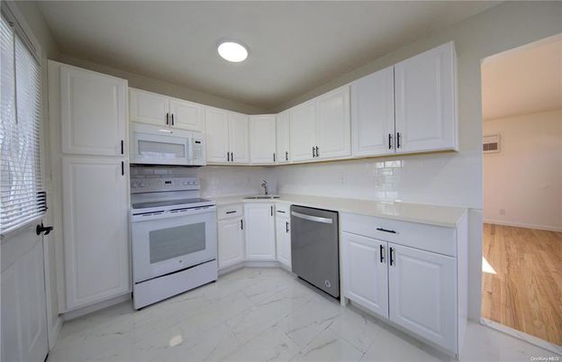 Interior, Kitchen, Marble, Recessed Lighting, Stainless Steel Appliances, Wood Texture Flooring