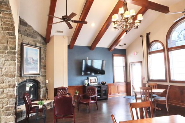 Chandelier, Dining room, Fireplace, Interior, Recessed Lighting, Stone Walls, Wooden Beams, Wood Texture Flooring