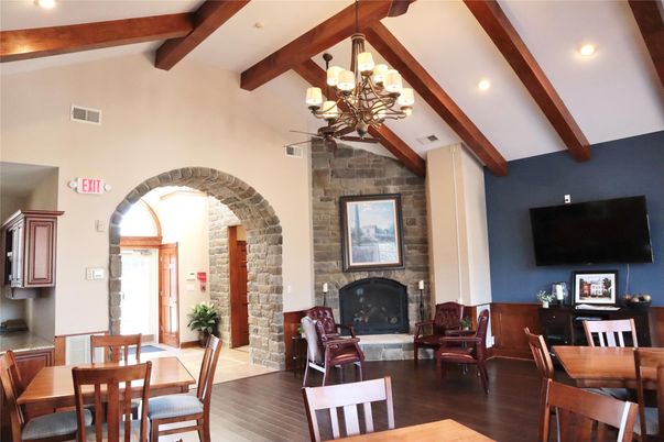 Chandelier, Dining room, Fireplace, Interior, Recessed Lighting, Stone Walls, Wooden Beams, Wood Texture Flooring