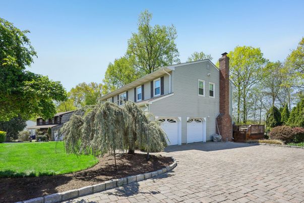Attached, Backyard, Exterior, Facade, Brick Facade, Split Level