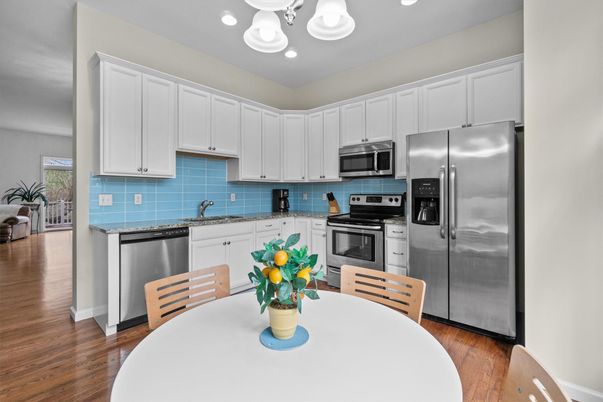 Dining room, Interior, Kitchen, Recessed Lighting, Stainless Steel Appliances, Wood Texture Flooring