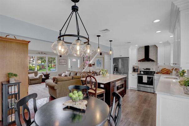 Dining room, Interior, Kitchen, Living room, Pendant Lights, Recessed Lighting, Stainless Steel Appliances, Wood Texture Flooring