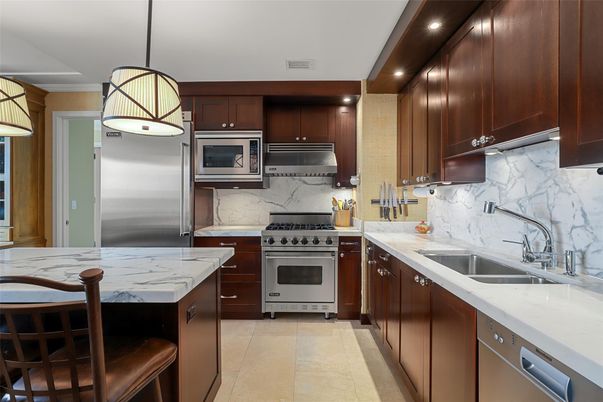 Interior, Kitchen, Marble Walls, Pendant Lights, Recessed Lighting, Stainless Steel Appliances