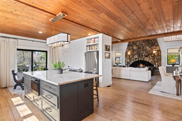 Dining room, Fireplace, Interior, Kitchen, Living room, Pendant Lights, Recessed Lighting, Stone Walls, Wooden Ceilings, Wood Texture Flooring