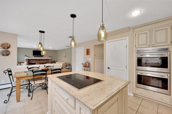 Dining room, Fireplace, Interior, Kitchen, Pendant Lights, Recessed Lighting, Stainless Steel Appliances, Stone Walls