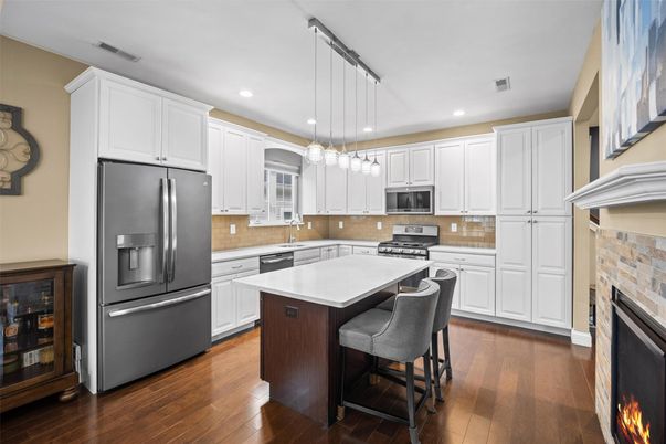 Fireplace, Interior, Kitchen, Pendant Lights, Recessed Lighting, Stainless Steel Appliances, Wood Texture Flooring