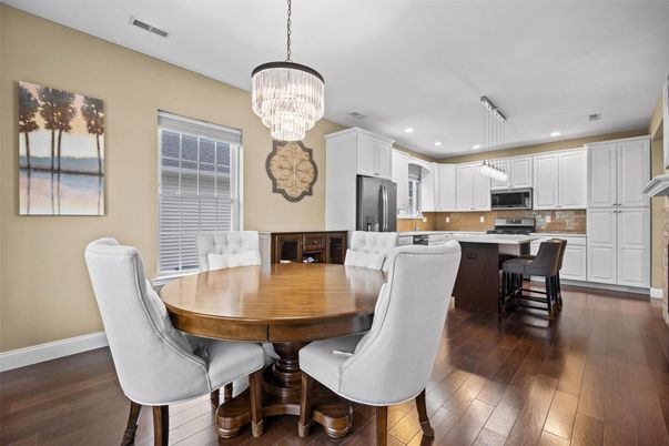 Chandelier, Dining room, Interior, Kitchen, Pendant Lights, Recessed Lighting, Stainless Steel Appliances, Wood Texture Flooring