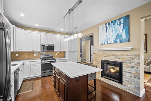 Fireplace, Interior, Kitchen, Pendant Lights, Recessed Lighting, Stainless Steel Appliances, Wood Texture Flooring