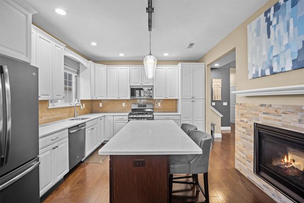 Fireplace, Interior, Kitchen, Pendant Lights, Recessed Lighting, Stainless Steel Appliances, Wood Texture Flooring