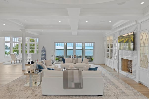 Dining room, Fireplace, Interior, Living room, Recessed Lighting, Water, Wood Texture Flooring