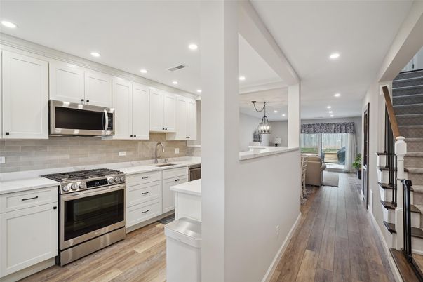 Chandelier, Interior, Kitchen, Pendant Lights, Recessed Lighting, Stainless Steel Appliances, Wood Texture Flooring