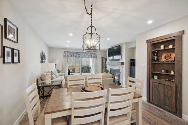 Dining room, Fireplace, Interior, Living room, Pendant Lights, Recessed Lighting, Wood Texture Flooring